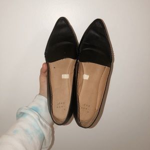 black pointed toe loafers.